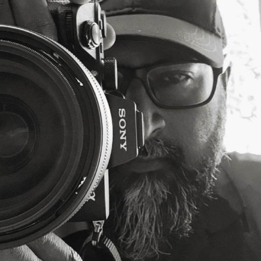 Remaraj, photographer, looking through his Sony camera