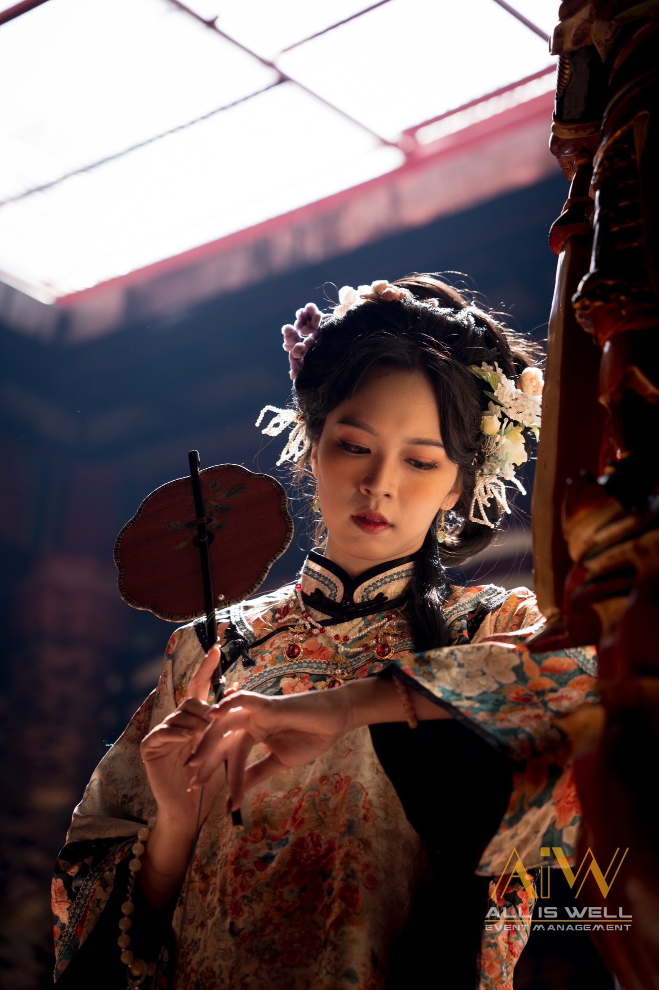 Portrait with fan in a sunbeam