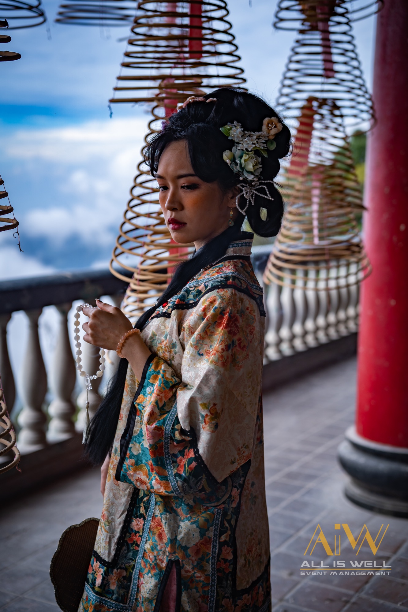 Portrait among hanging incense coils