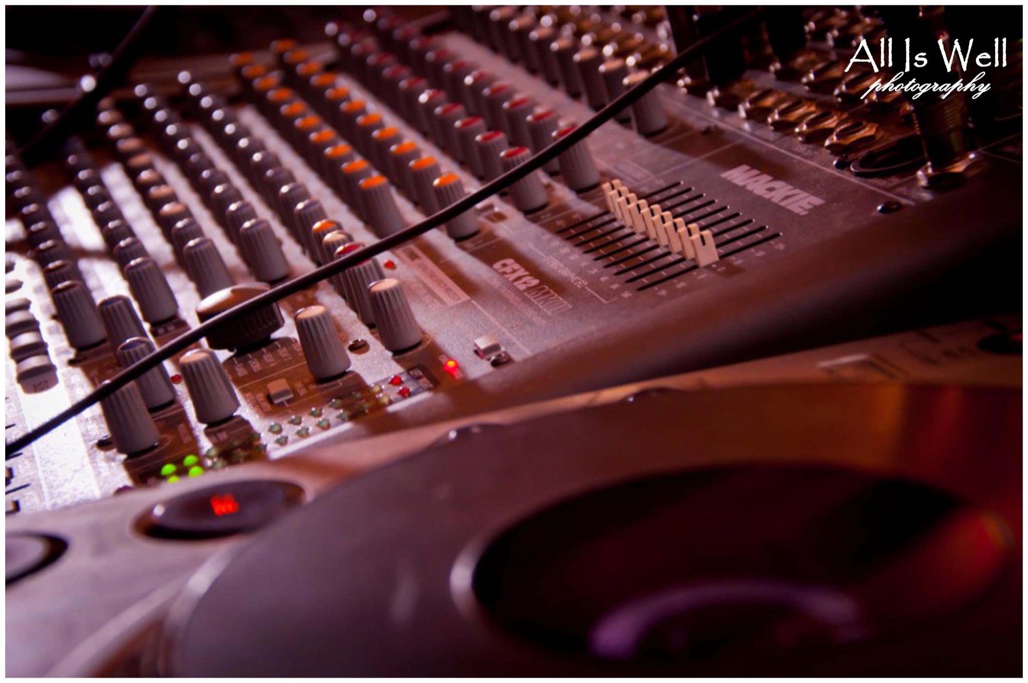 Close-up of a DJ mixing console at an event