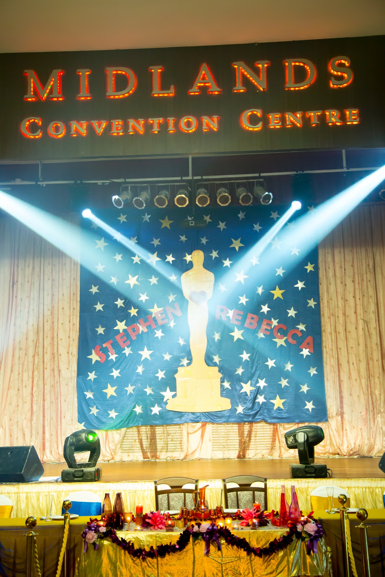 Oscar-themed reception stage set with spotlights