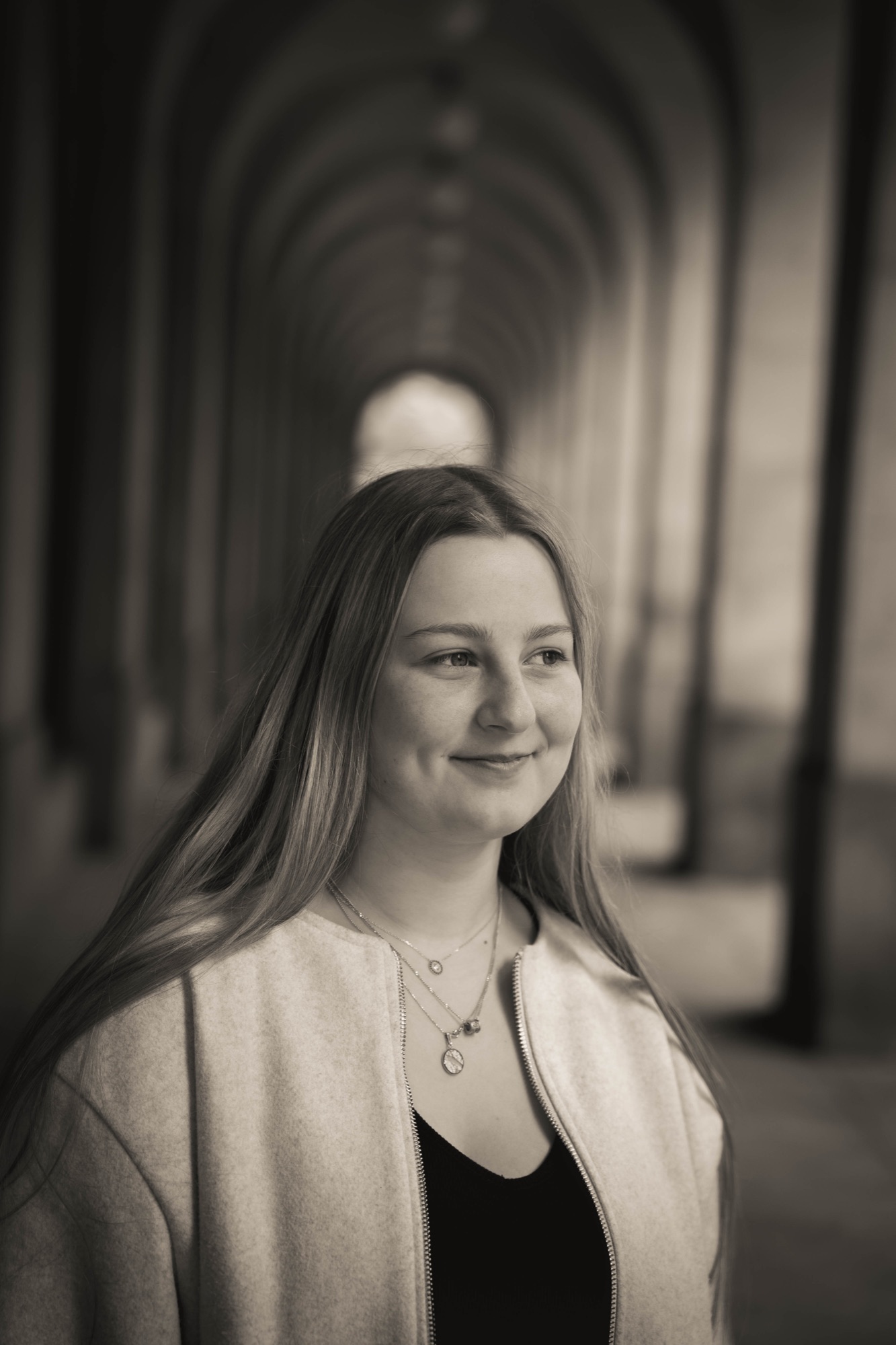 Black and white portrait under an archway