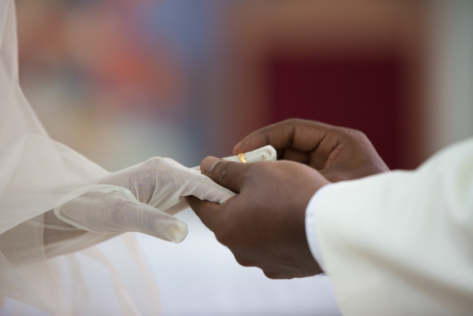Detail of hands exchanging rings